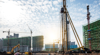 Spiral pile driver on construction site